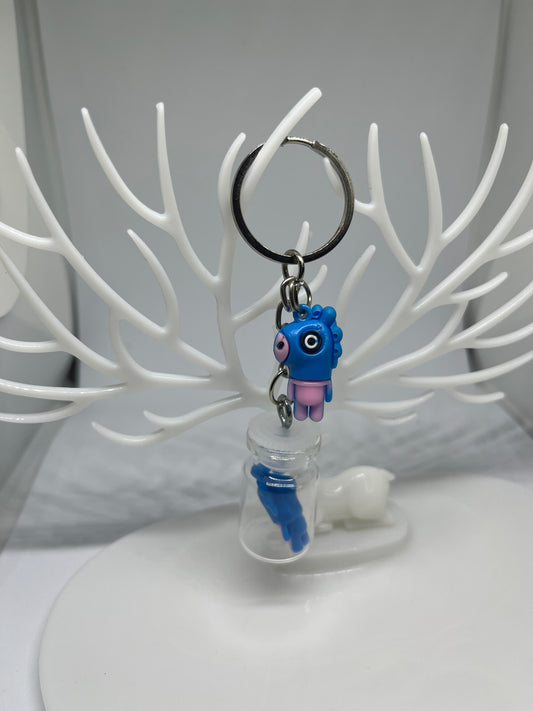 Blue cartoon in a bottle keychain